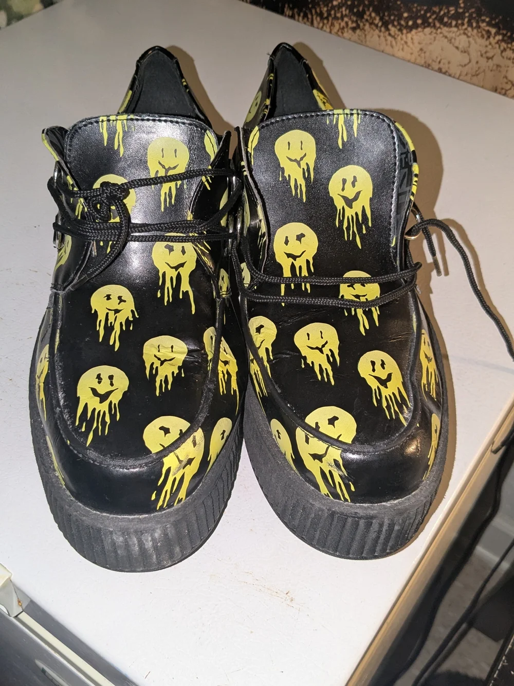 tuk Black Platform Creeper Shoes with Yellow Dripping Smiley Print